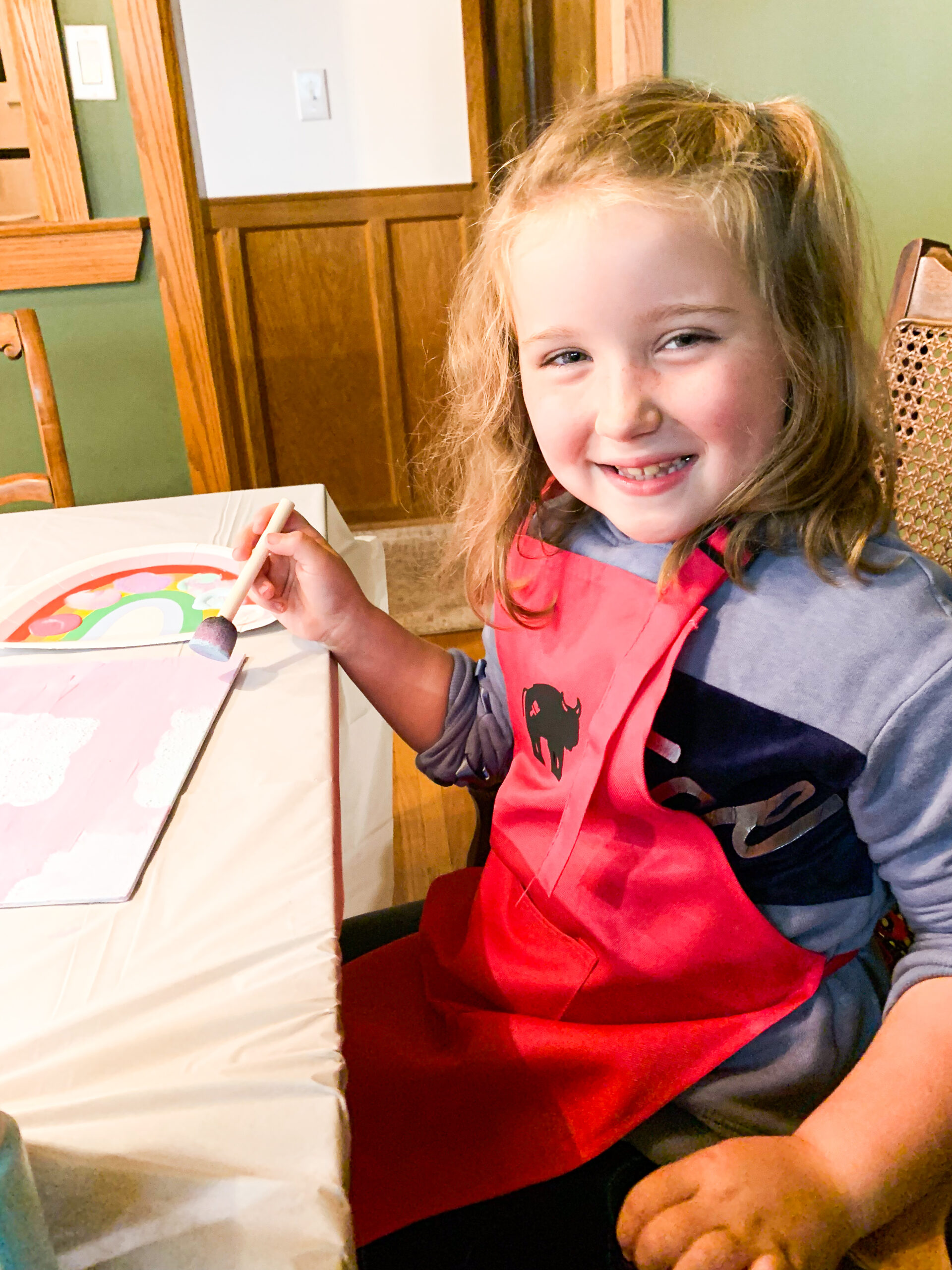 happy child painting at a craft party
