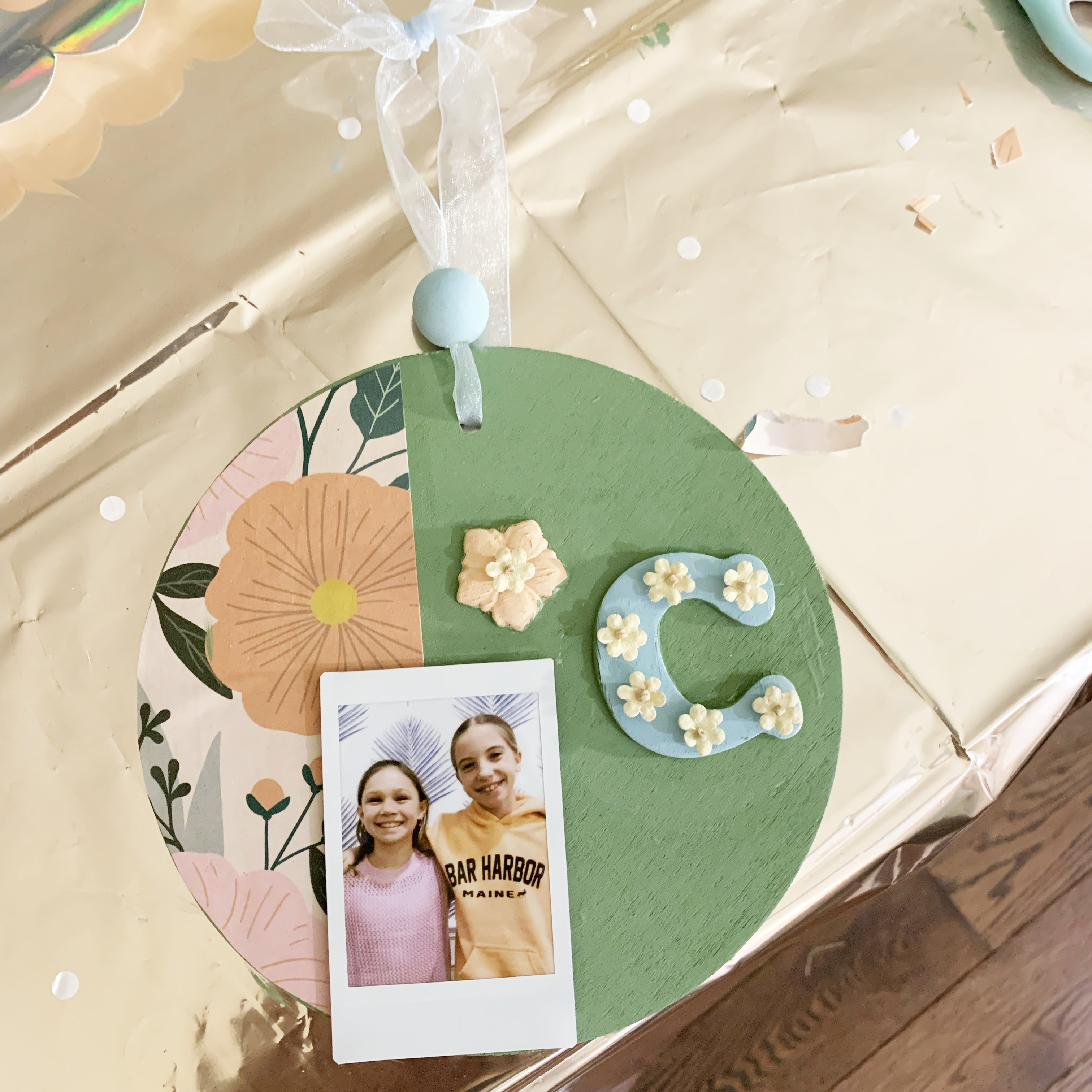 child painting a wooden photo frame at a craft party